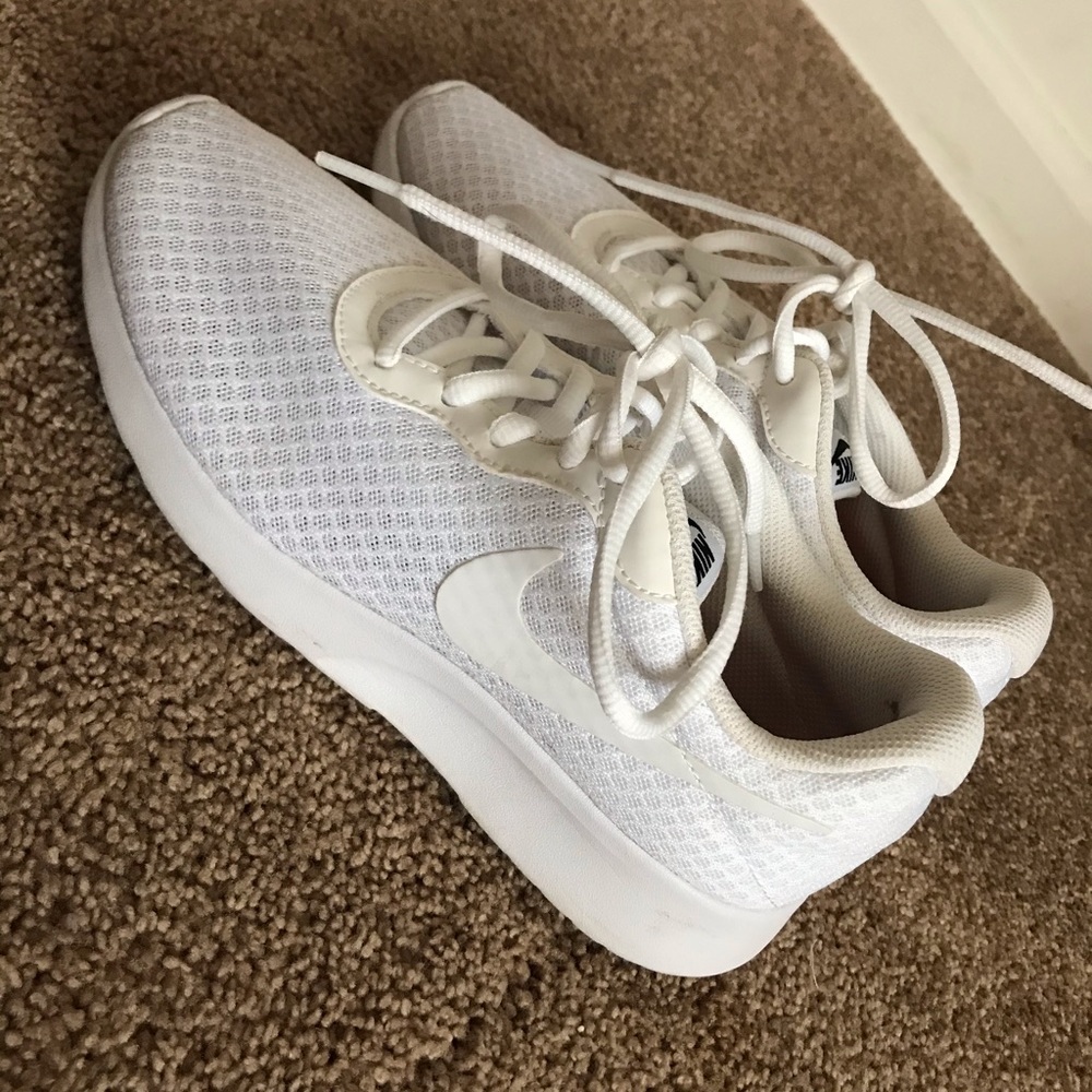 All white Nike sneakers